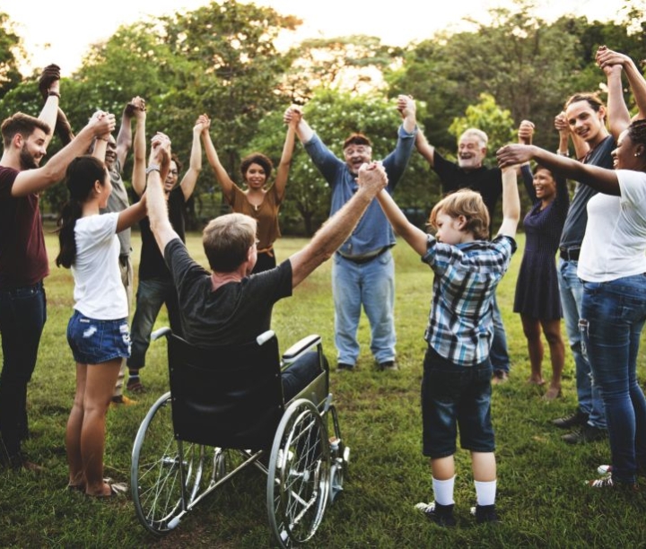 groups of people in a circle holding hands